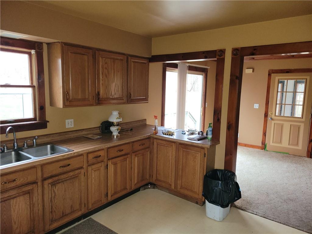 116 Willadell Road Transfer, PA 16154 - Photo 9 of 23 a kitchen with stainless steel appliances granite countertop a sink a stove and a wooden cabinets