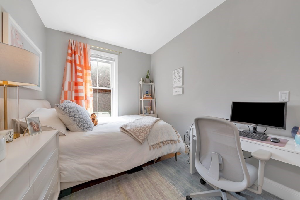 10 East Springfield Street, Unit 3 Boston, MA 02118 - Photo 17 of 26 a bedroom with a bed and a flat screen tv