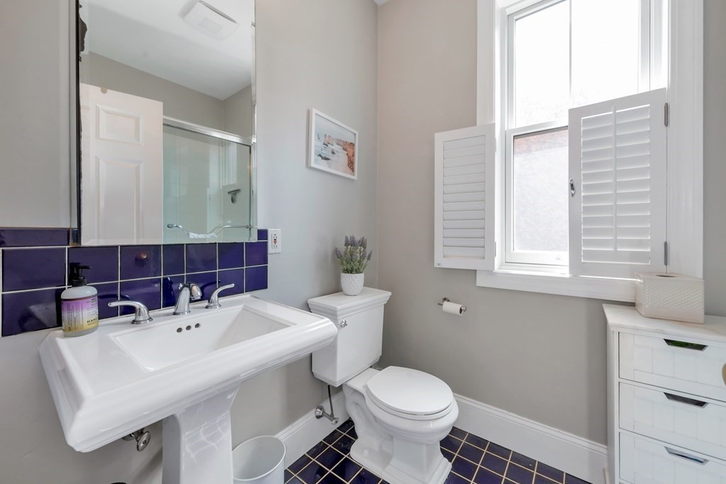 10 East Springfield Street, Unit 3 Boston, MA 02118 - Photo 18 of 26 a bathroom with a sink toilet and a mirror