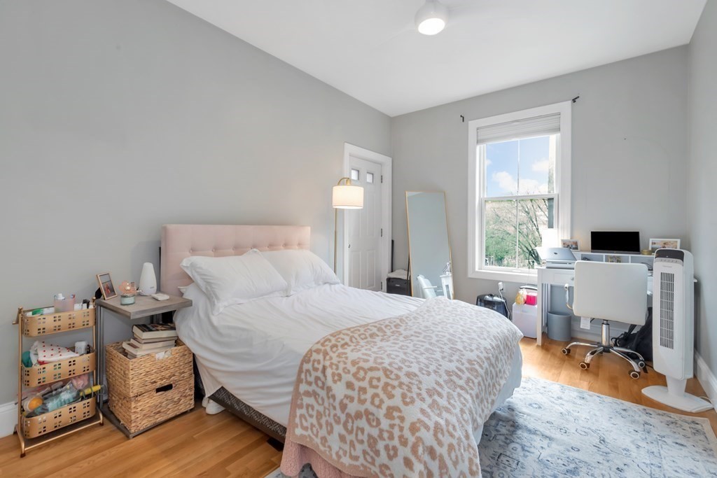 10 East Springfield Street, Unit 3 Boston, MA 02118 - Photo 20 of 26 a bedroom with a bed and wooden floor