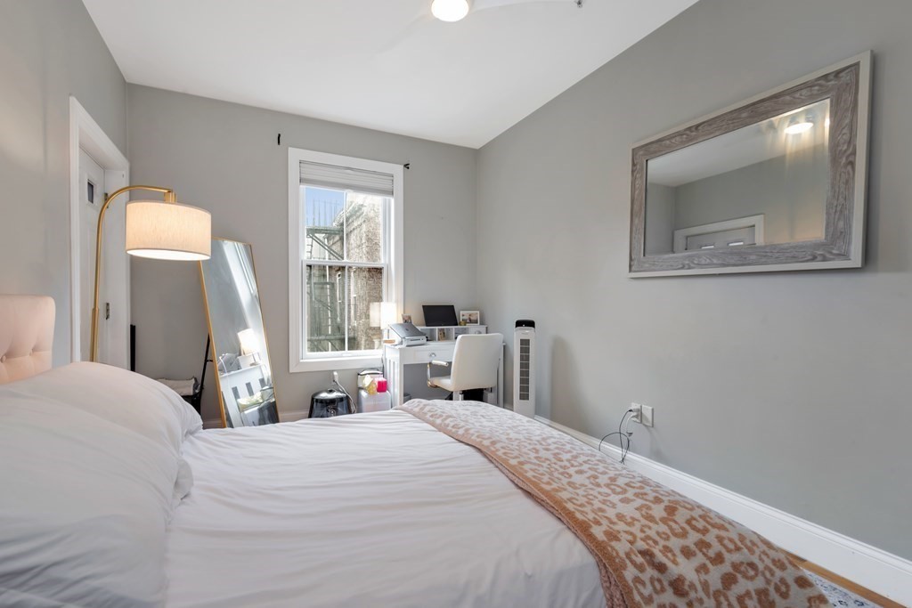 10 East Springfield Street, Unit 3 Boston, MA 02118 - Photo 21 of 26 a bedroom with a bed and a window