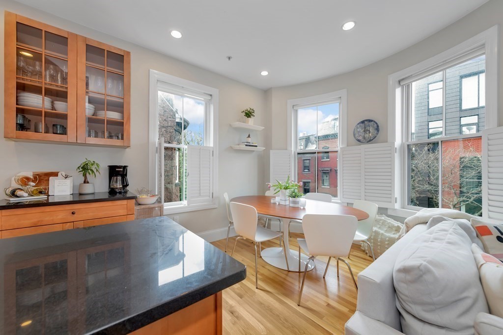 10 East Springfield Street, Unit 3 Boston, MA 02118 - Photo 8 of 26 a living room with fireplace furniture and a large window