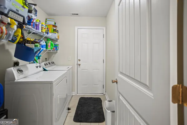 a bathroom with a sink a vanity and a shower curtain