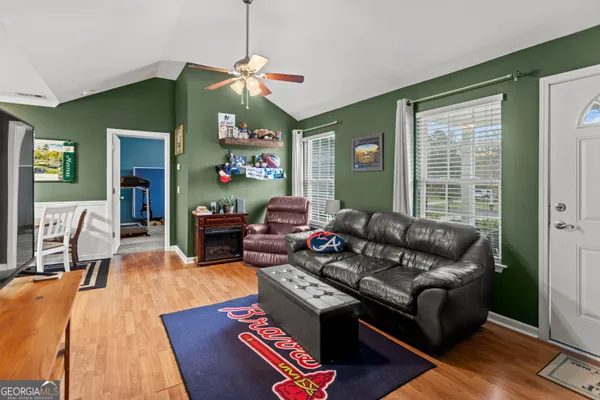 a living room with furniture and a window