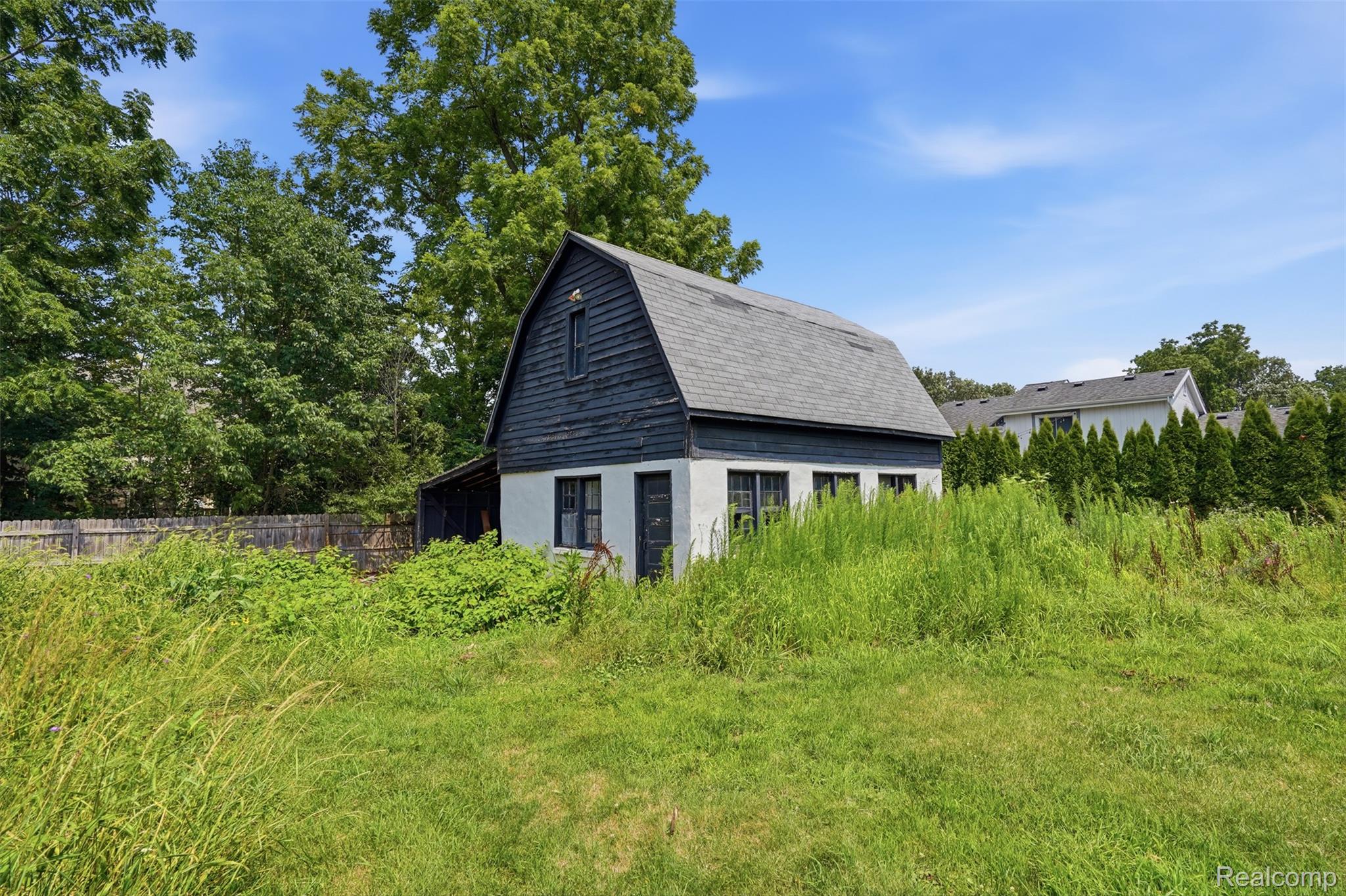 31000 Drake Road Farmington, MI 48331 - Photo 31 of 44 Barn-style structure featuring a gambrel roof and dark siding