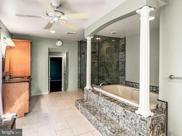 a bathroom with a bathtub and shower