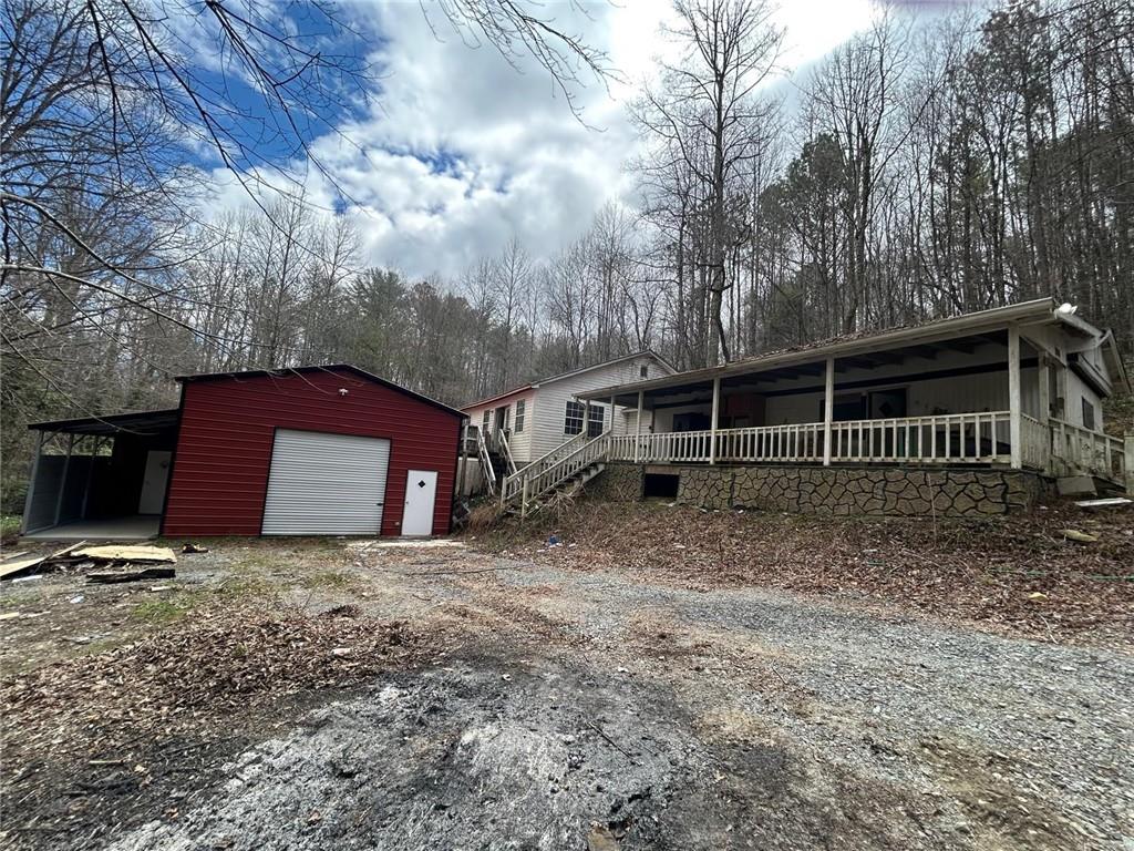 345 Southern Road Ellijay, GA 30536 - Photo 1 of 1 a house with trees in front of it
