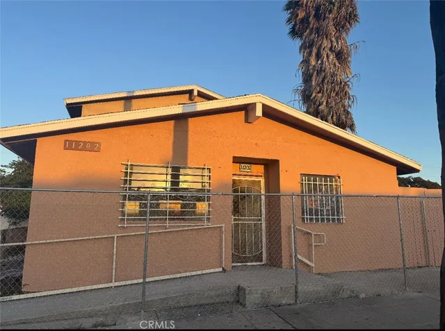 a blue and white building with glass windows