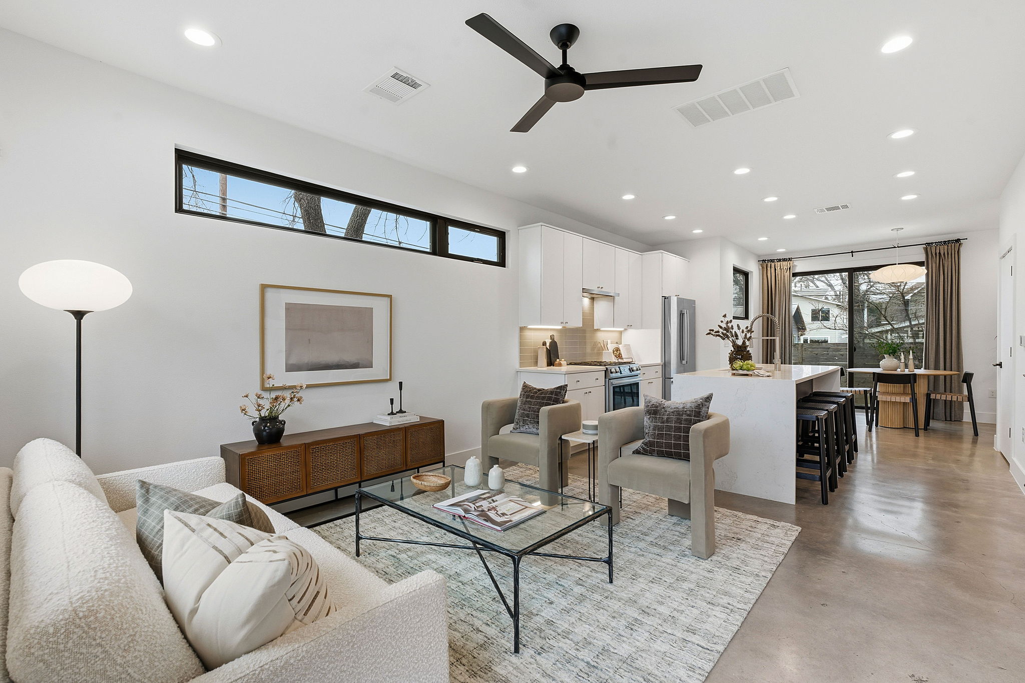 2411 Santa Rosa Street, Unit A Austin, TX 78702 - Photo 1 of 1 Living area with finished concrete flooring, recessed lighting, and a ceiling fan
