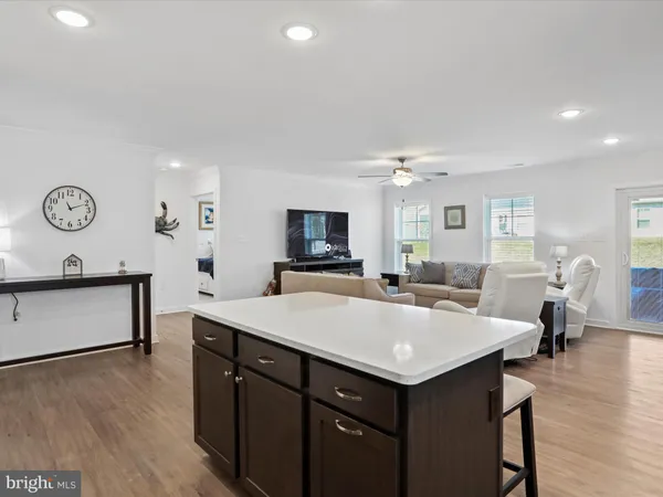 a view of kitchen island a sink and living room