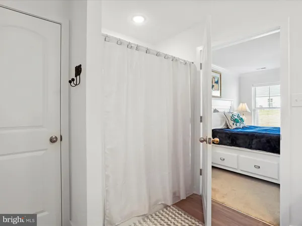 a bathroom with a shower and a sink