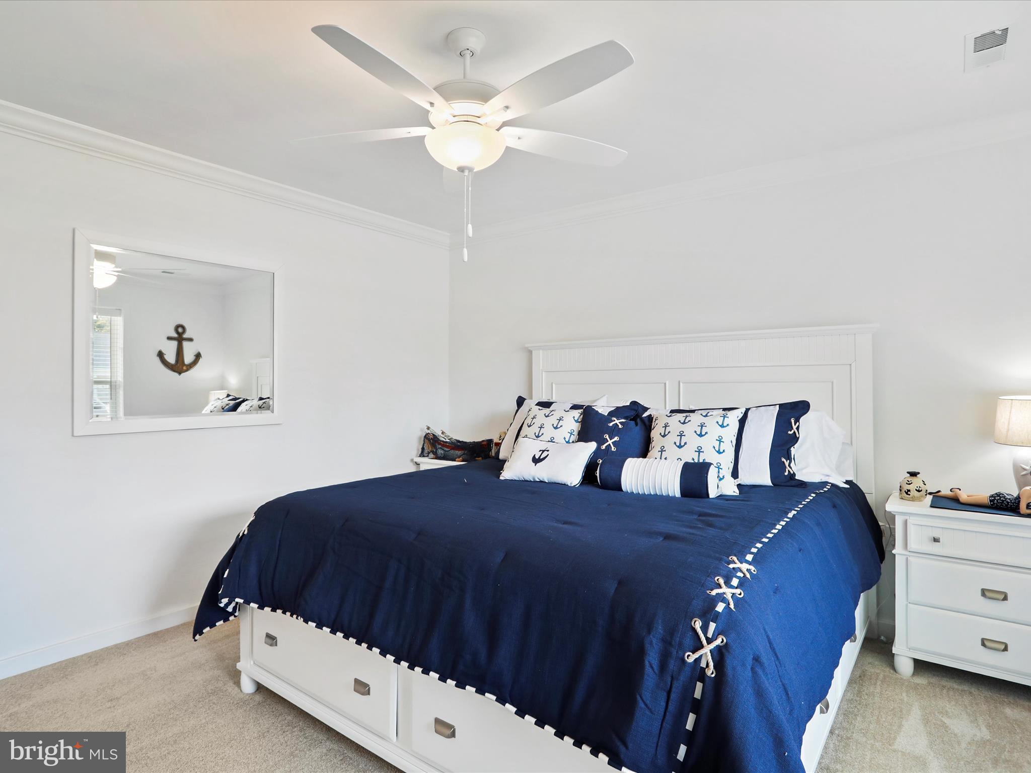 791 Dripping Spring Drive Hammondsville, OH 43930 - Photo 25 of 33 a bedroom with a bed and a chandelier