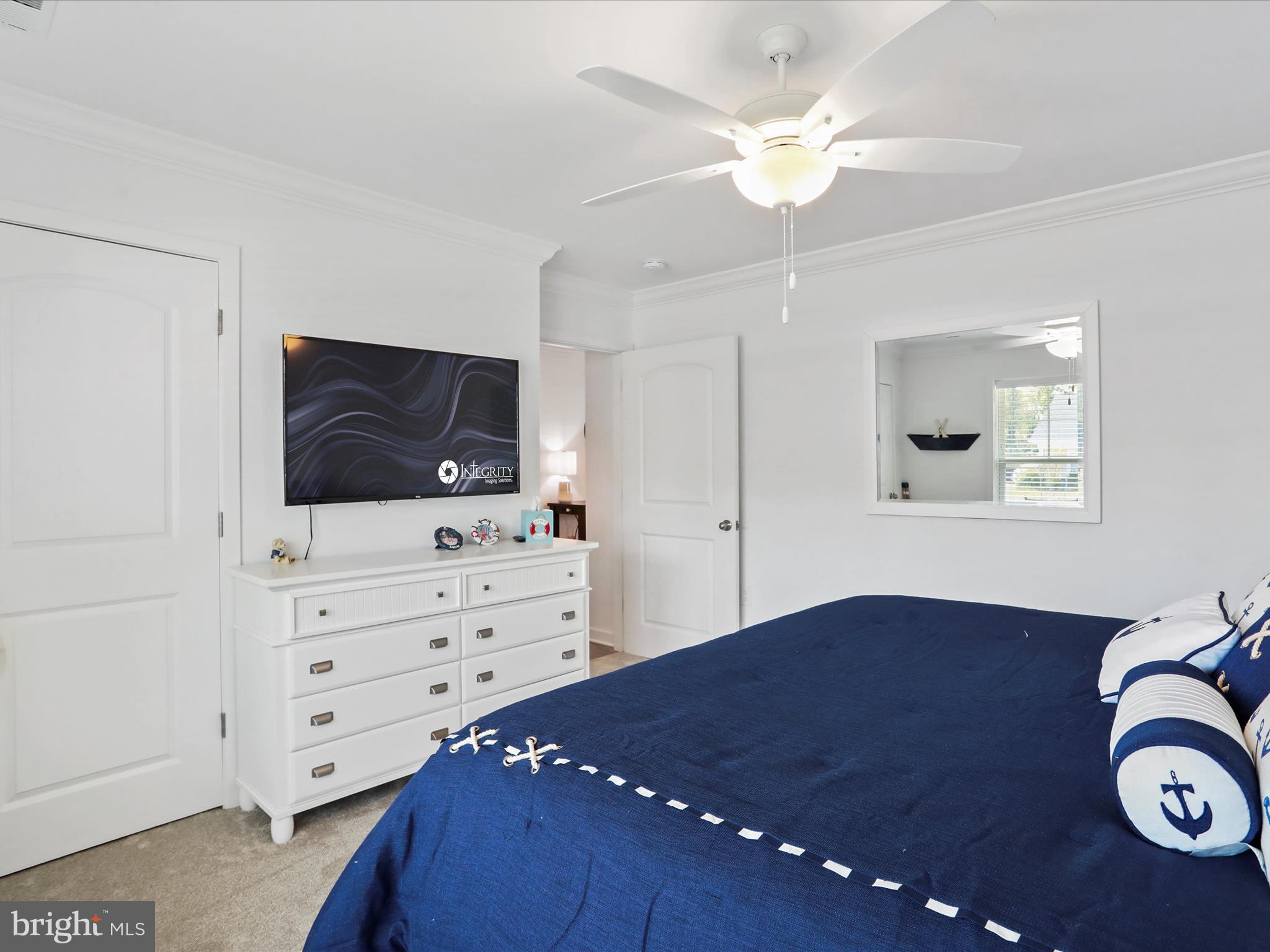 791 Dripping Spring Drive Hammondsville, OH 43930 - Photo 26 of 33 a bedroom with a bed and a chandelier