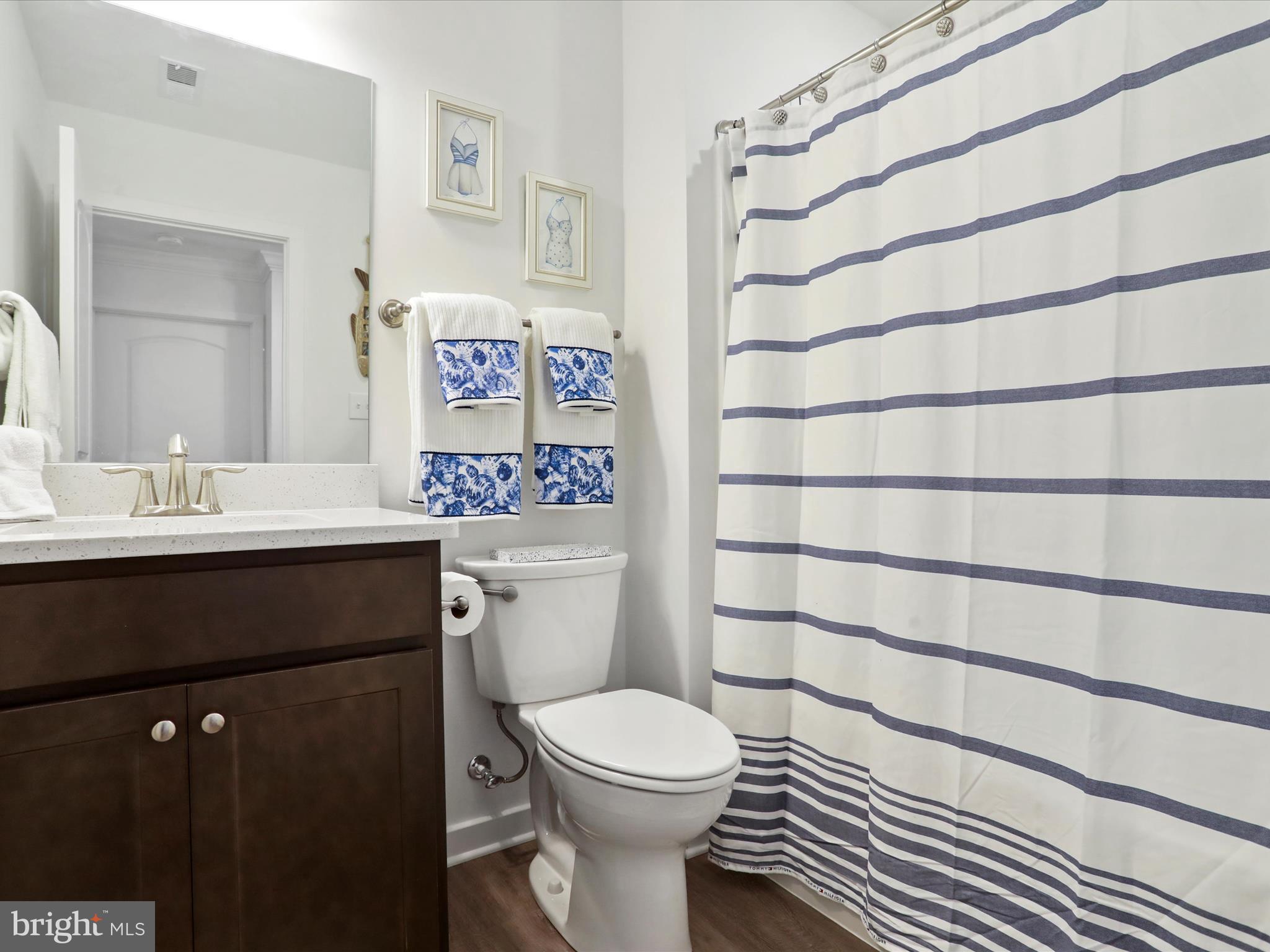 791 Dripping Spring Drive Hammondsville, OH 43930 - Photo 27 of 33 a bathroom with a sink a toilet and a shower