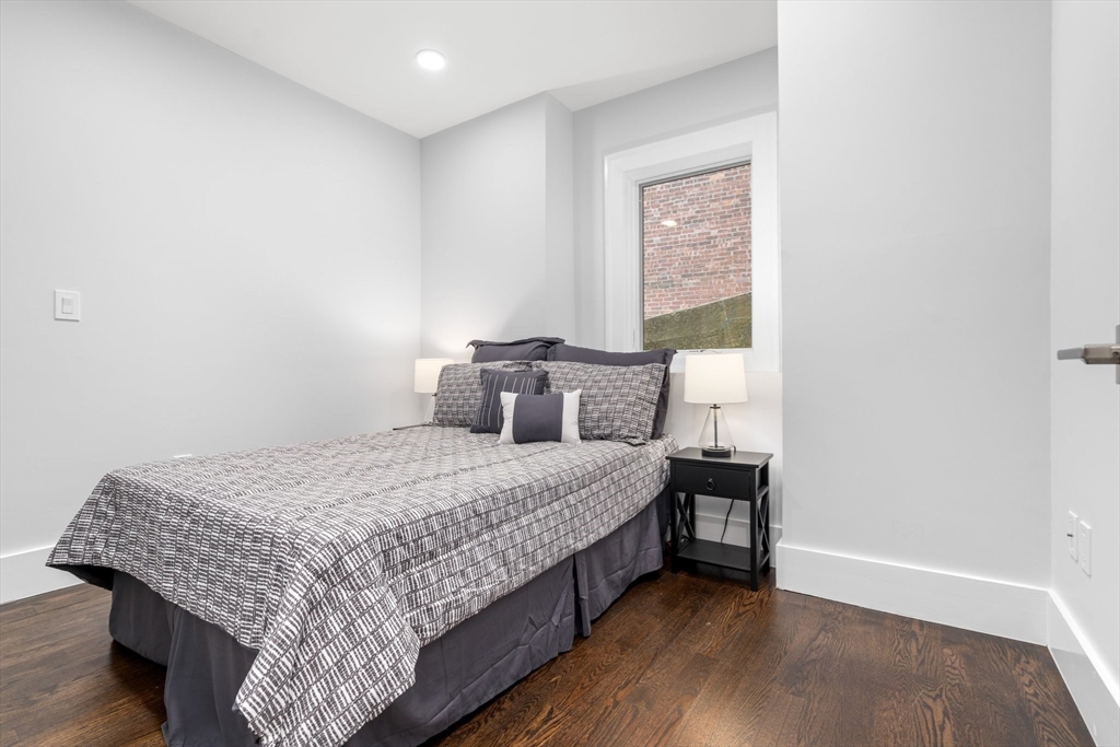 111 Winthrop Road, Unit 1 Brookline, MA 02445 - Photo 14 of 20 a bedroom with a bed and window