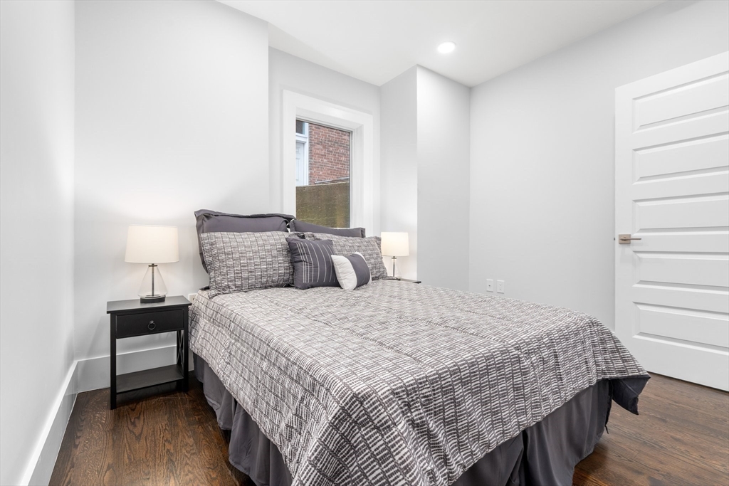 111 Winthrop Road, Unit 1 Brookline, MA 02445 - Photo 15 of 20 a bedroom with a bed and a window