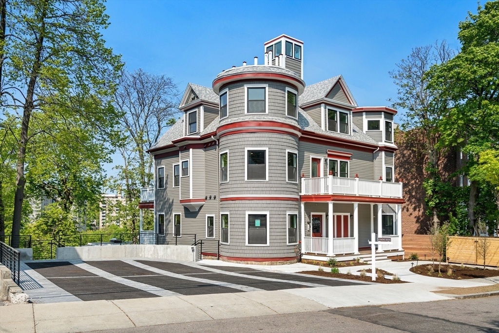 111 Winthrop Road, Unit 1 Brookline, MA 02445 - Photo 2 of 20 a front view of a house with a yard