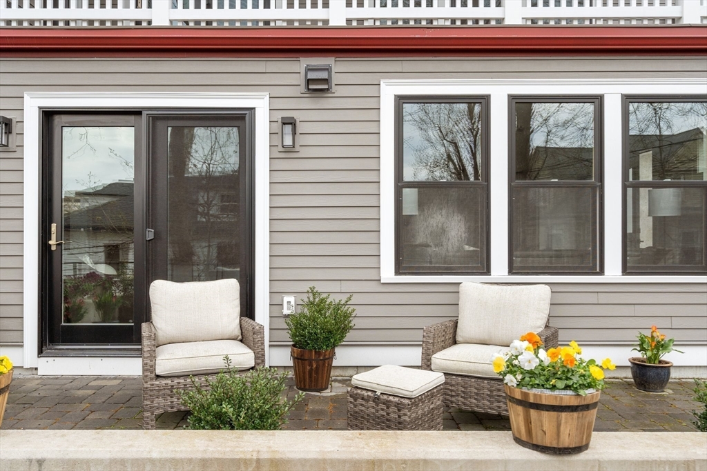 111 Winthrop Road, Unit 1 Brookline, MA 02445 - Photo 5 of 20 a potted plant sitting on the side of a building