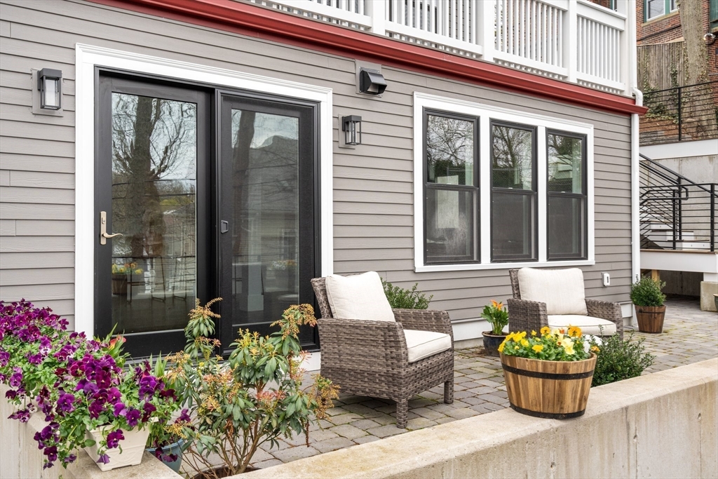 111 Winthrop Road, Unit 1 Brookline, MA 02445 - Photo 6 of 20 a front view of a house with outdoor seating