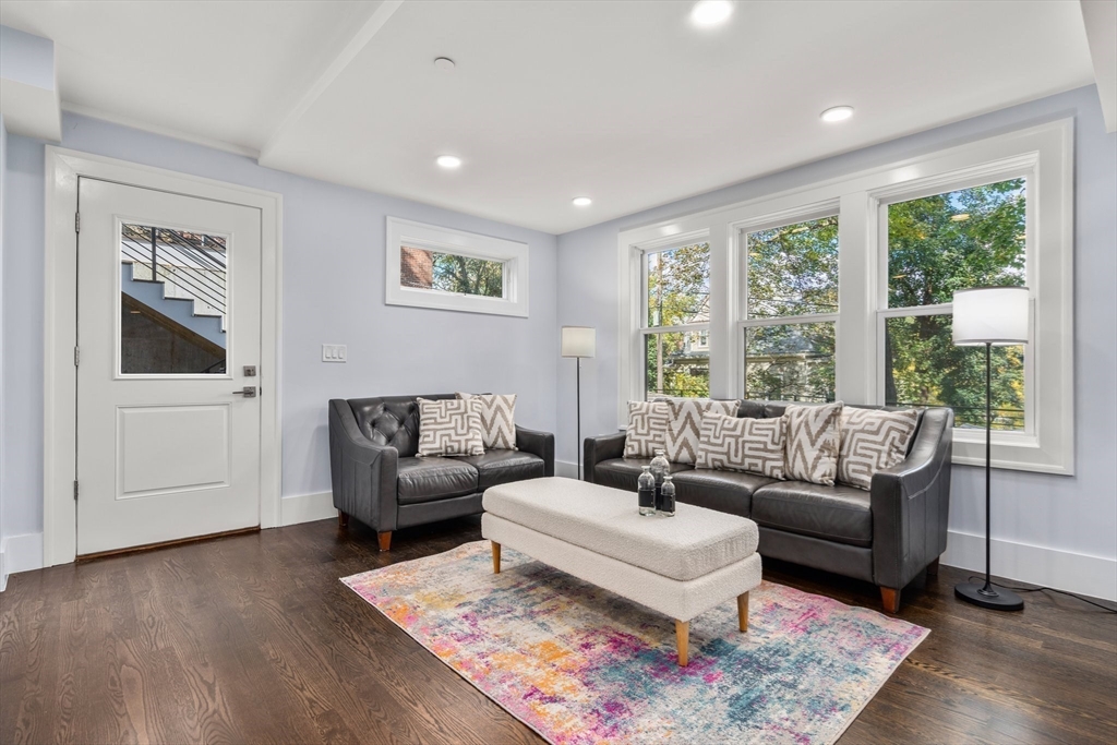111 Winthrop Road, Unit 1 Brookline, MA 02445 - Photo 7 of 20 a living room with furniture and a rug
