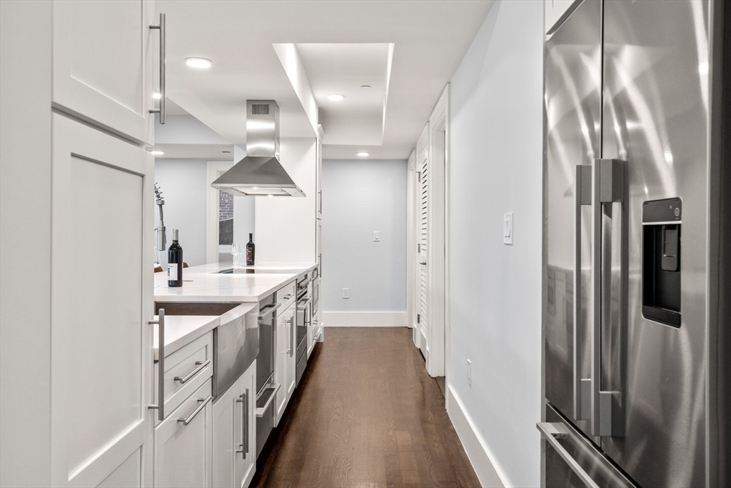 111 Winthrop Road, Unit 1 Brookline, MA 02445 - Photo 10 of 20 a kitchen with stainless steel appliances a sink and a refrigerator