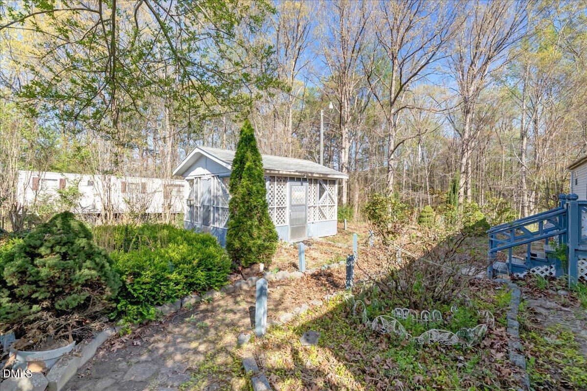 266 Macon-Embro Road Macon, NC 27551 - Photo 29 of 41 a front view of a house with garden