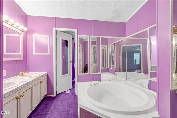 a bathroom with a sink a toilet and tub