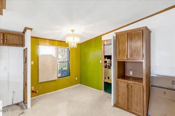 a spacious bathroom with a sink a mirror and a shower
