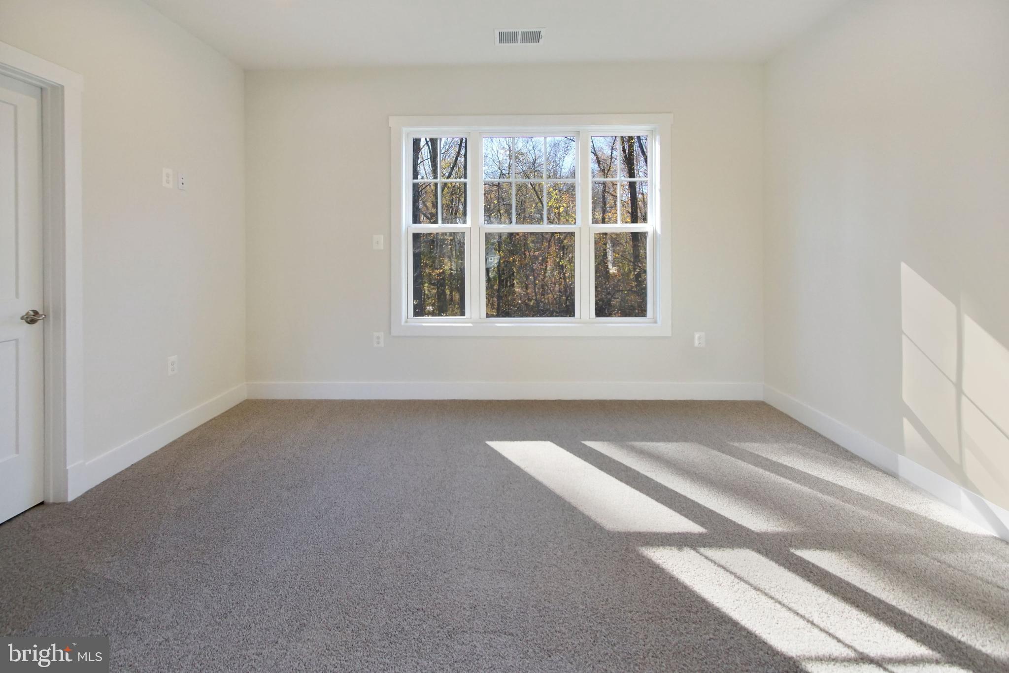 7327 Wisteria Point Drive, Unit 34 Hanover, MD 21076 - Photo 32 of 36 an empty room with a window