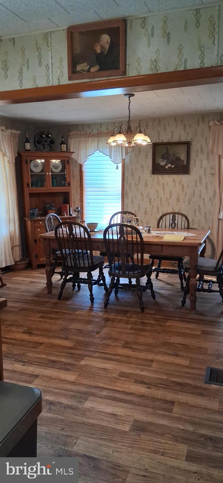 1927 Cumberland Road Bedford, PA 15522 - Photo 32 of 61 a living room with furniture and a wooden floor