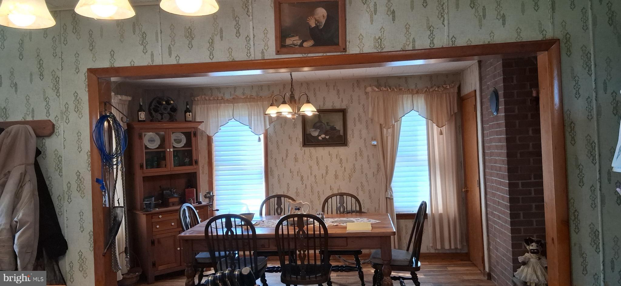 1927 Cumberland Road Bedford, PA 15522 - Photo 33 of 61 a view of a dining room with furniture and chandelier