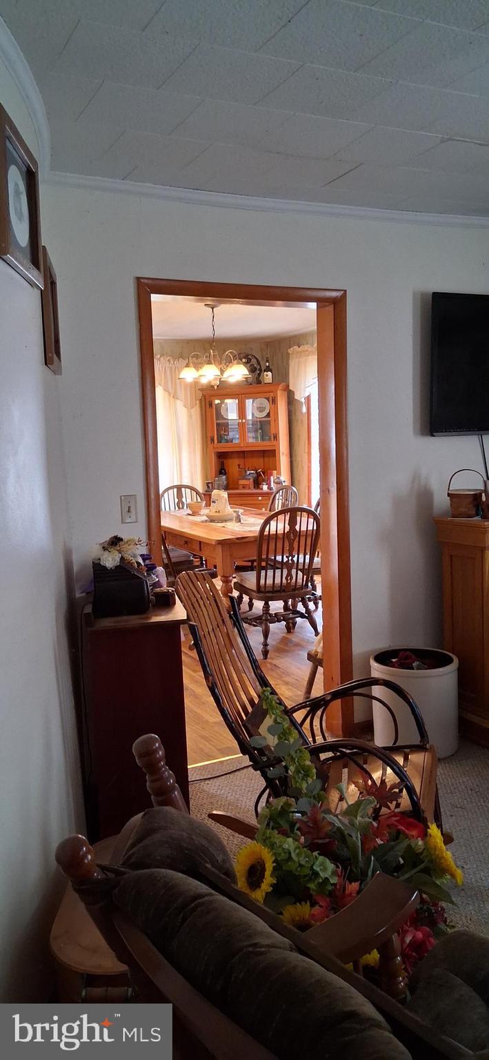 1927 Cumberland Road Bedford, PA 15522 - Photo 37 of 61 a room with furniture and flat screen tv