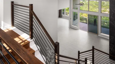 a view of an entryway with wooden floor