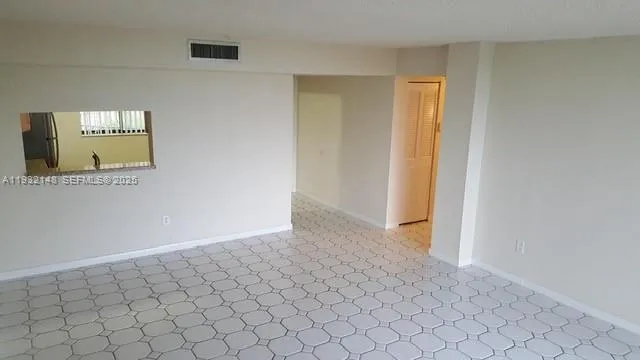 a view of an empty room and window