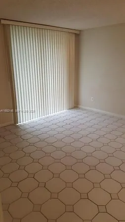 a view of wooden floor and a window