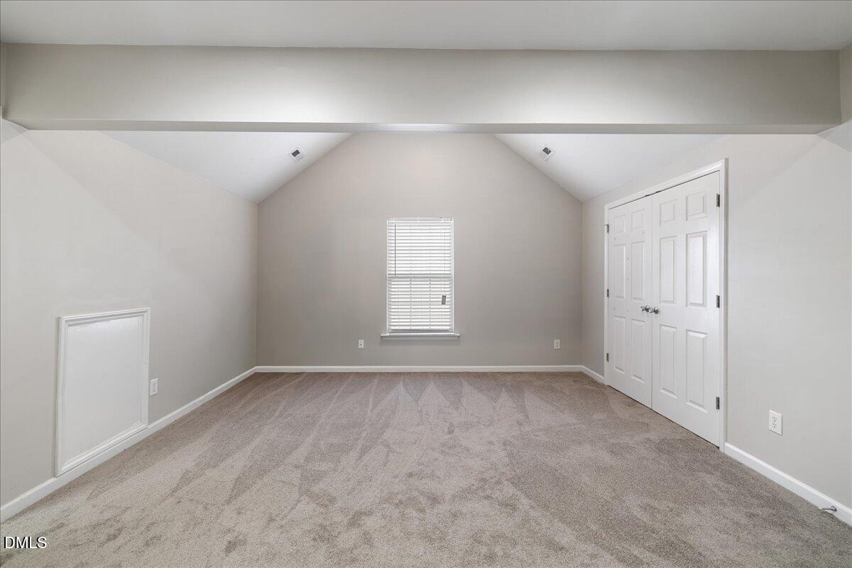 505 Pyracantha Drive Holly Springs, NC 27540 - Photo 17 of 41 a view of an empty room with a window