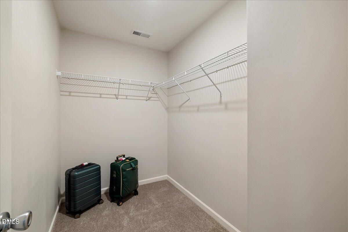 505 Pyracantha Drive Holly Springs, NC 27540 - Photo 22 of 41 a view of a room with racks on the wall