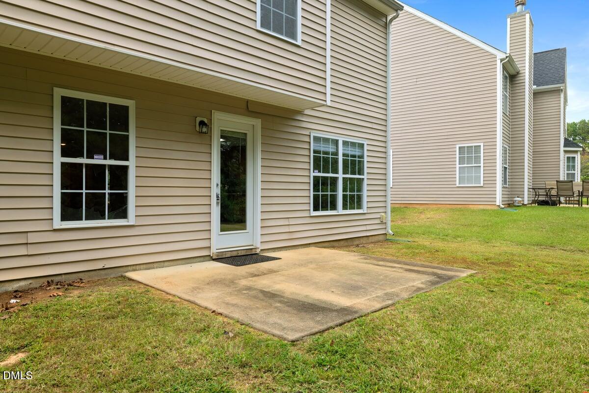 505 Pyracantha Drive Holly Springs, NC 27540 - Photo 28 of 41 a view of a backyard with large windows