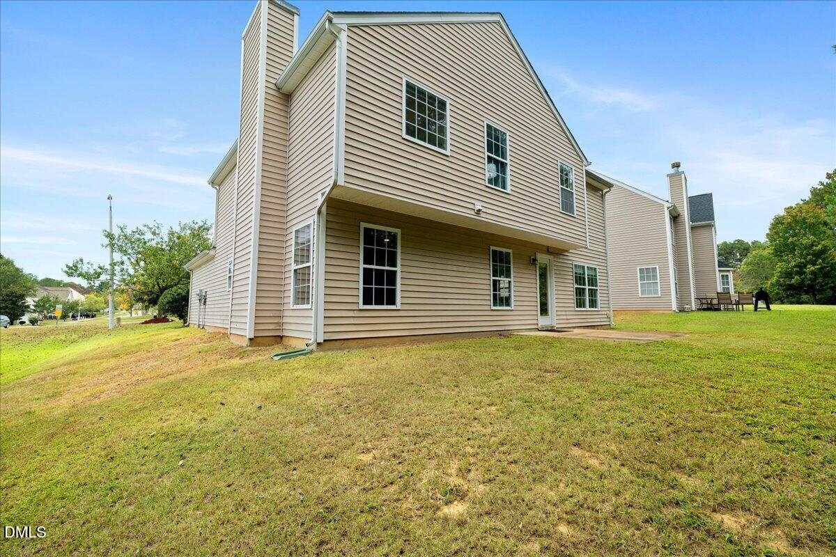 505 Pyracantha Drive Holly Springs, NC 27540 - Photo 30 of 41 a house that has a big yard in front of it