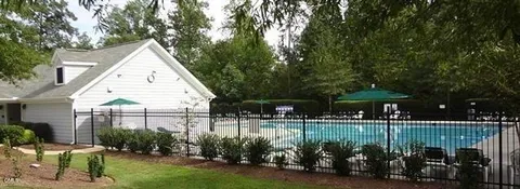 an aerial view of a house with swimming pool