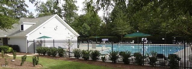 505 Pyracantha Drive Holly Springs, NC 27540 - Photo 36 of 41 a view of a house with backyard and sitting area