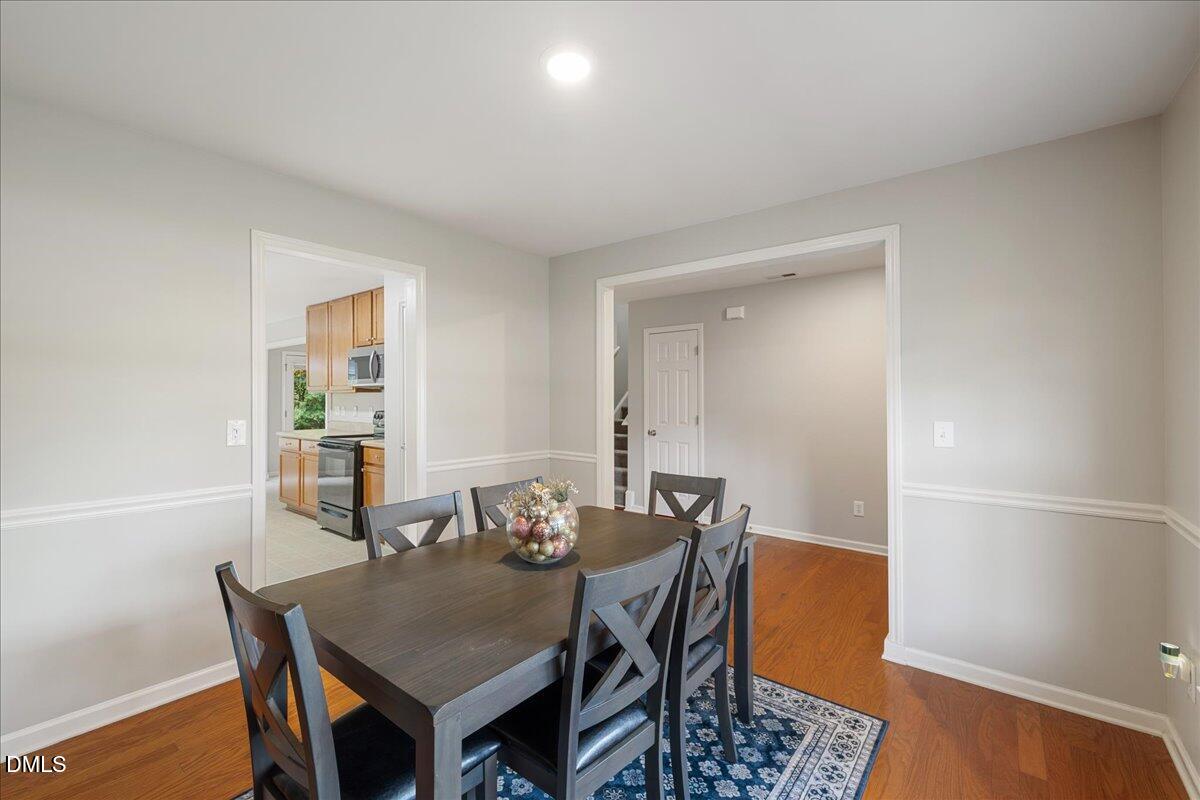 505 Pyracantha Drive Holly Springs, NC 27540 - Photo 7 of 41 a view of a dining room with furniture