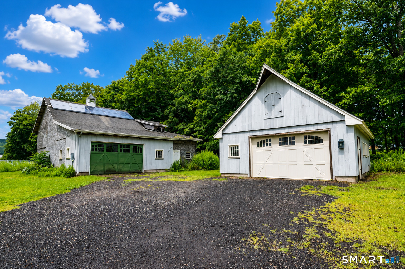 19 High Street Middlefield, CT 06455 - Photo 3 of 18 Exceptional outbuildings include a detached garage and large barn with leased solar panels, offering incredible versatility for vehicles, hobbies, storage, and workshop space.