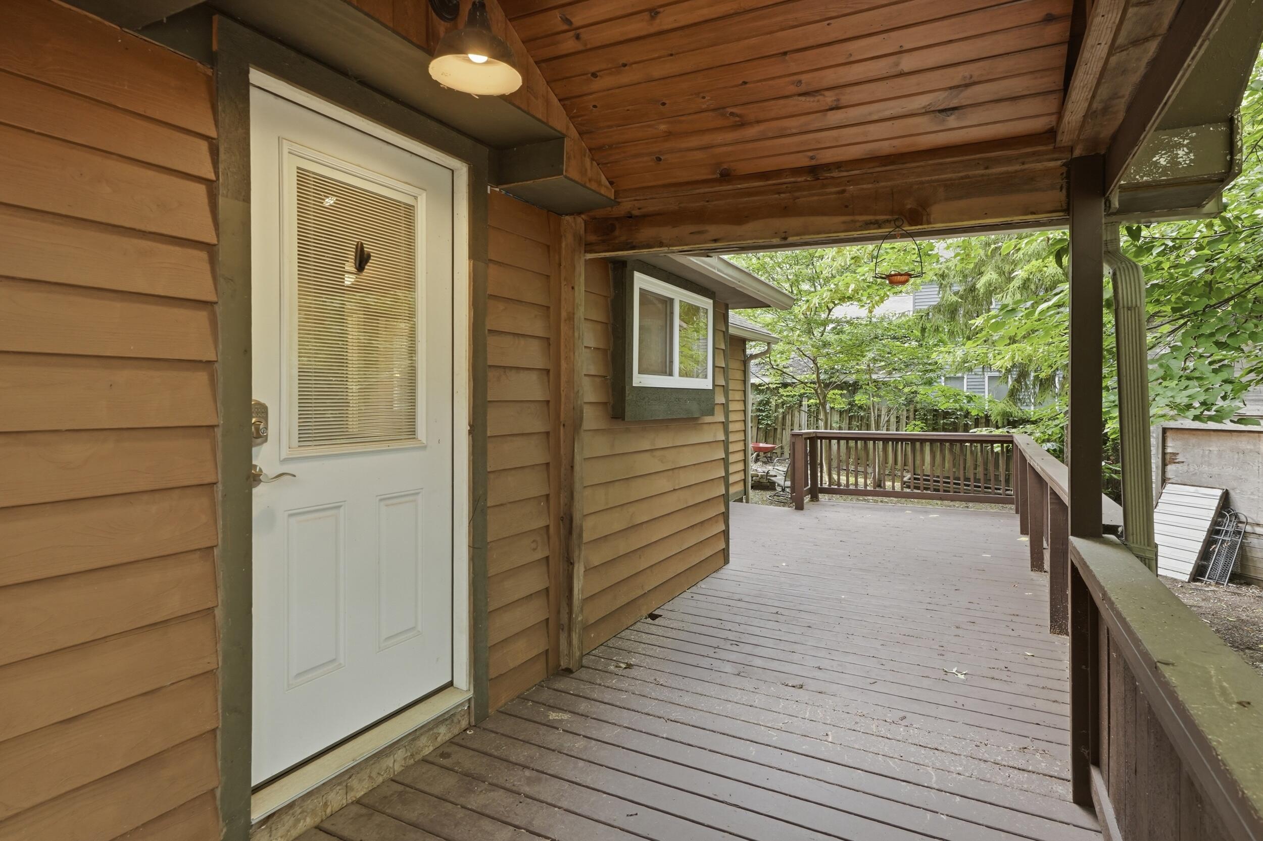 1307 Redwing Road Valparaiso, IN 46383 - Photo 17 of 20 a view of a balcony with wooden floor and iron stairs