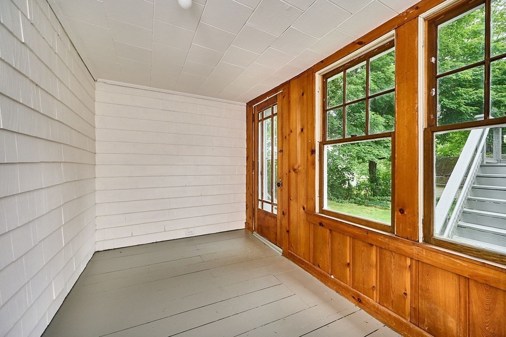 19 Powell Street Northampton, MA 01062 - Photo 12 of 40 a view of a porch with wooden floor and a window