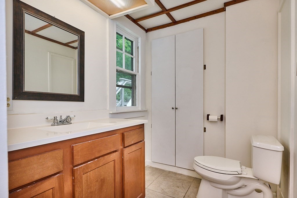 19 Powell Street Northampton, MA 01062 - Photo 13 of 40 a bathroom with a toilet sink and mirror