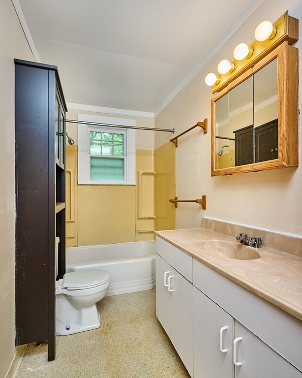 19 Powell Street Northampton, MA 01062 - Photo 20 of 40 a bathroom with a sink a toilet and shower
