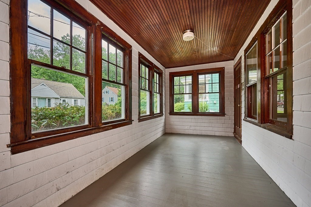 19 Powell Street Northampton, MA 01062 - Photo 2 of 40 wooden floor in an empty room with a window