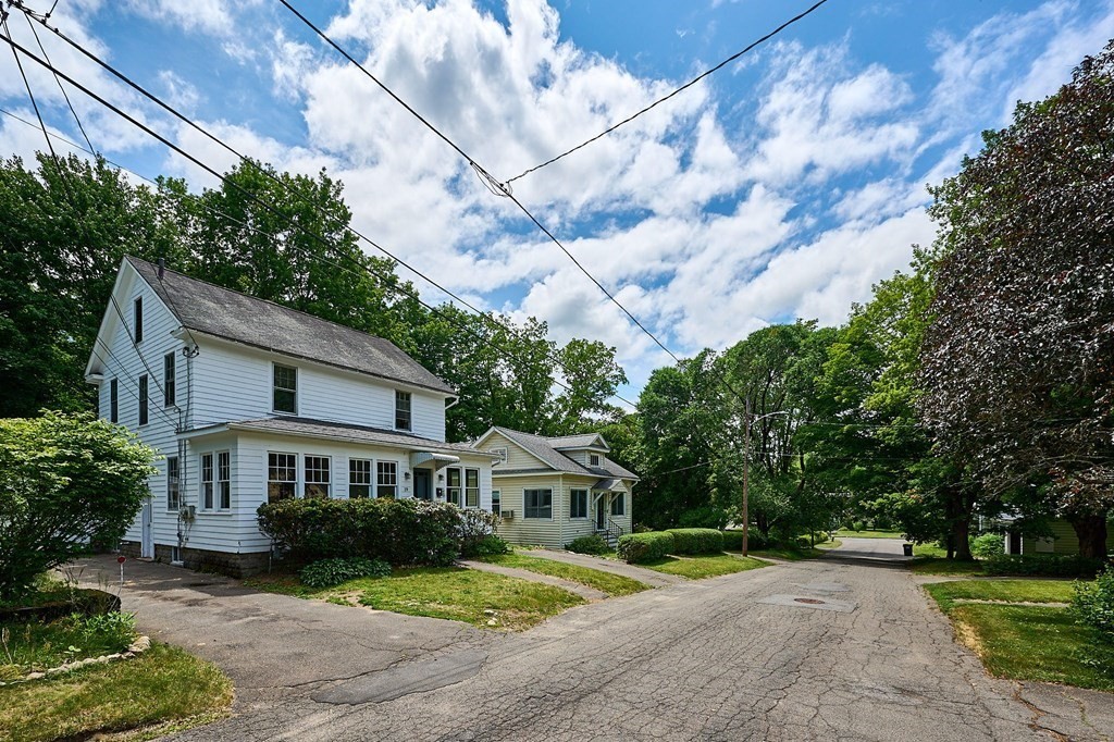 19 Powell Street Northampton, MA 01062 - Photo 25 of 40 a front view of a house with a yard and a porch