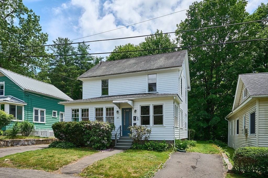 19 Powell Street Northampton, MA 01062 - Photo 26 of 40 a front view of a house with a yard and potted plants